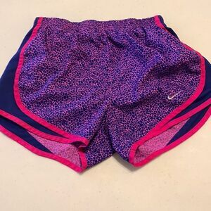 Nike dry fit Size XS athletic shorts with built in panty. Color is navy and pink